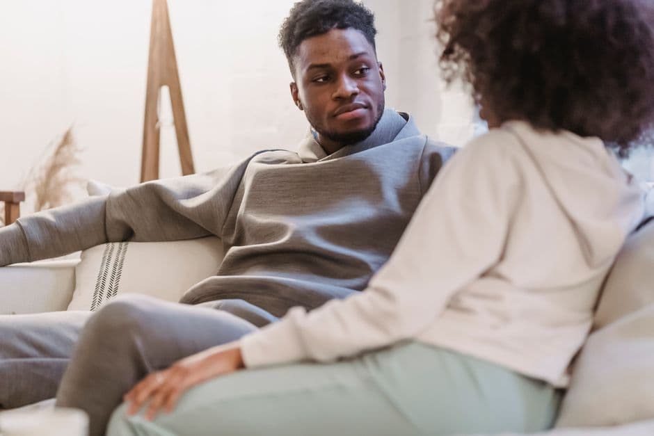 A couple in conversation at home