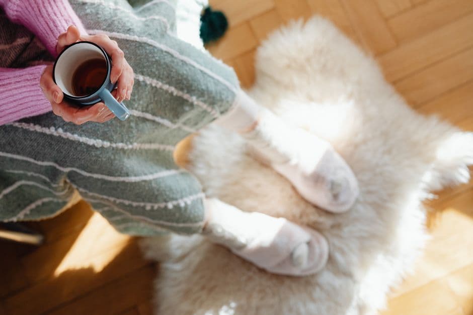 Warm hands around a cup of tea